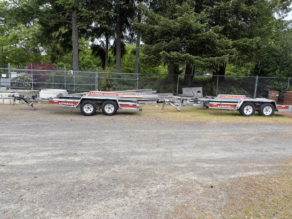 U-Haul trailer hauling multiple vehicles